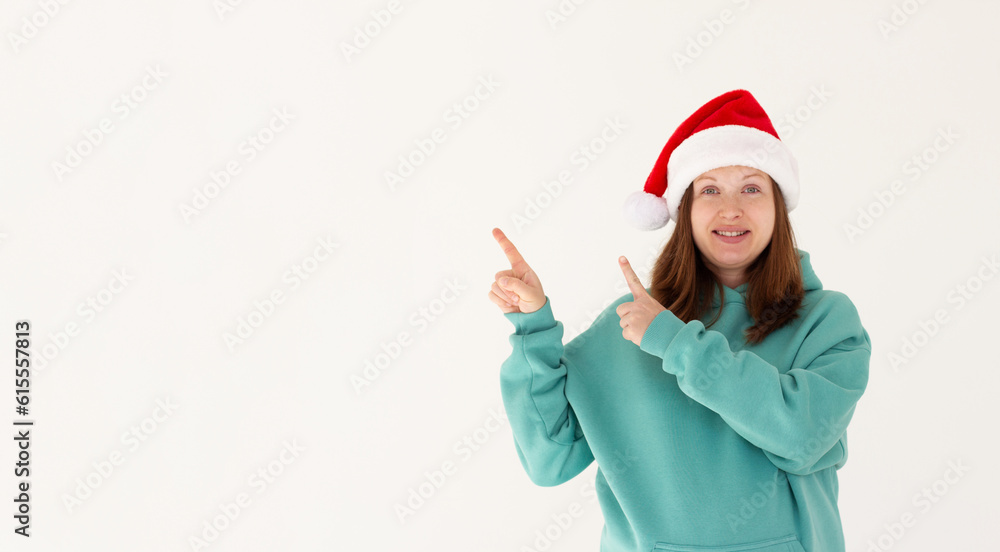 Photo of charming pregnant lovely pretty nice girl in santa claus headwear point index finger copyspace, indicate x-mas jolly holly advertisement isolated over white color background Photo of charming pregnant lovely pretty nice girl in santa claus headwear point index finger copyspace, indicate x-mas jolly holly advertisement isolated over white color background