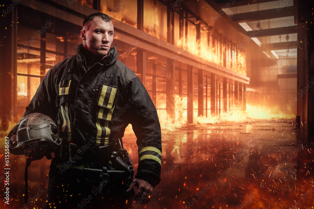 Confident and brave firefighter holding a protective helmet amidst a raging inferno inside an office building. The image evokes a strong sense of courage and determination Confident and brave firefighter holding a protective helmet amidst a raging inferno inside an office building. The image evokes a strong sense of courage and determination