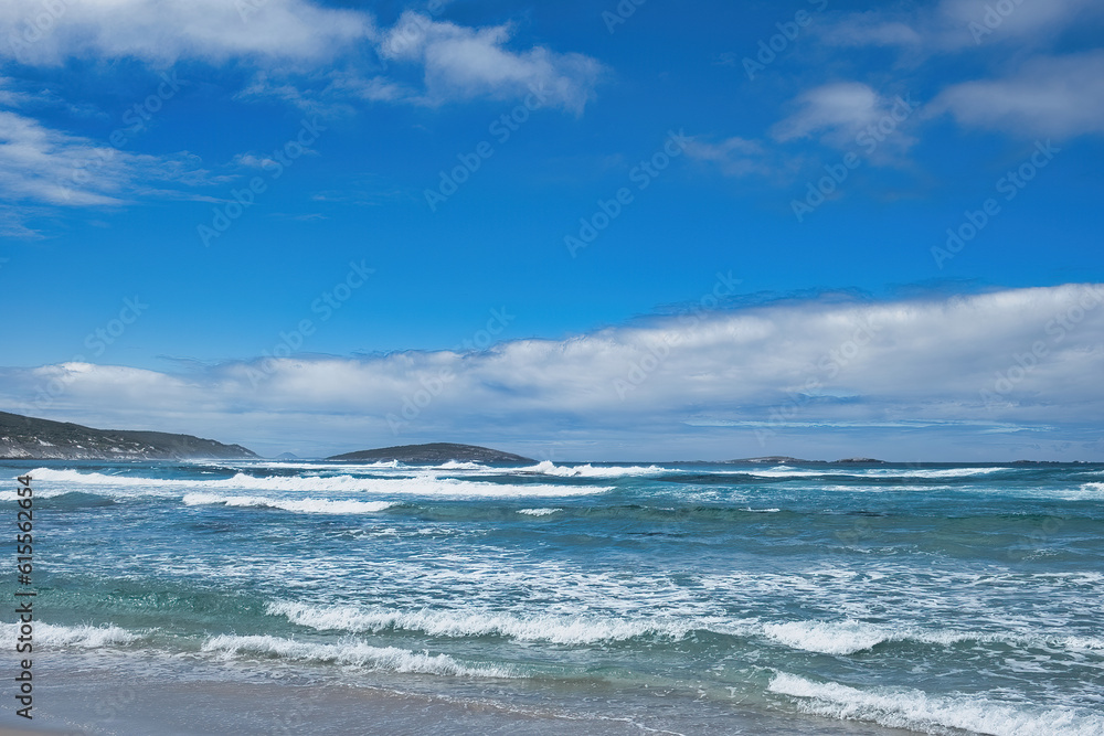 Seascape with surf, clouds, islands and a blue sky. Recherche Archipelago, Western Australia
