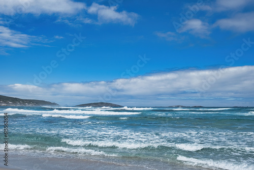 Seascape with surf  clouds  islands and a blue sky. Recherche Archipelago  Western Australia 