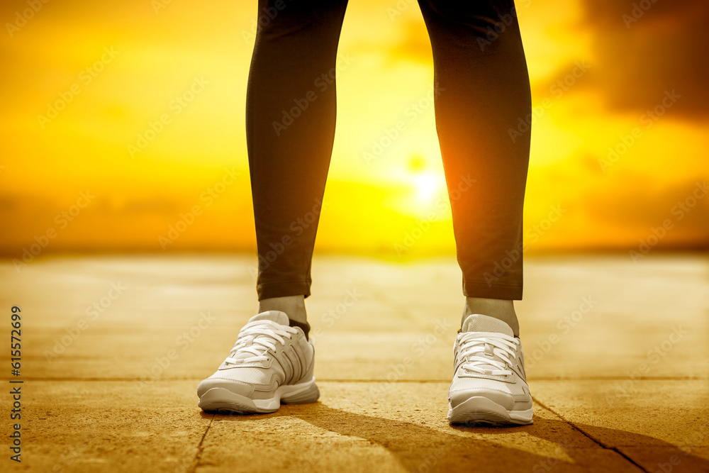 young woman runner running on city bridge road young woman runner running on city bridge road
