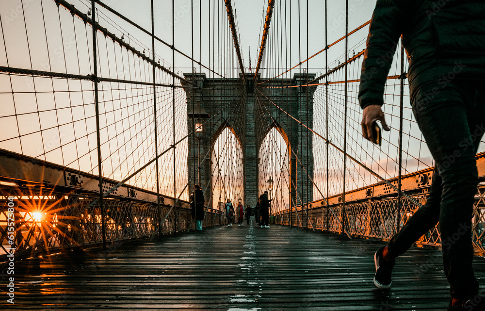 Fototapeta premium runner feet at Brooklyn Bridge New York at sunrise