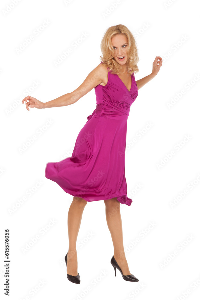Beautiful blonde girl dance in a pink dress, shot in height on a white background