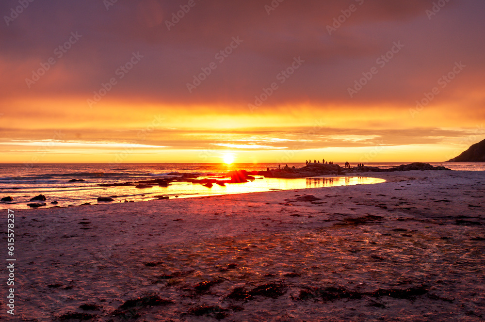 Sunset with illuminated water and sandy beach - Skagen, Lofoten, Norway. Sunset with illuminated water and sandy beach - Skagen, Lofoten, Norway.