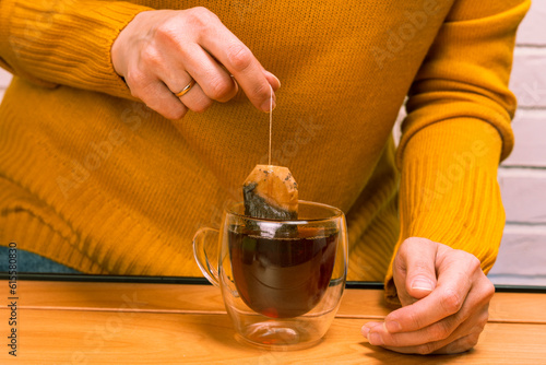 women's caring hands brew delicious fragrant tea