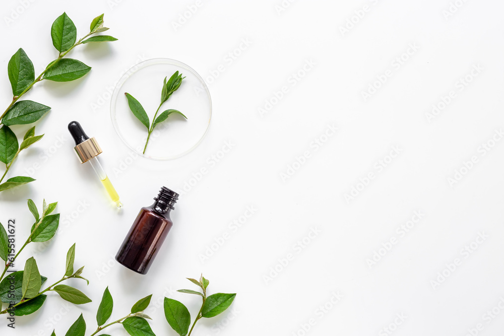 Cosmetic herbal essential serum oil in bottle with pipette Cosmetic herbal essential serum oil in bottle with pipette