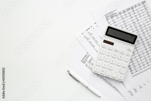 Financial business report preparing with calculator on office table