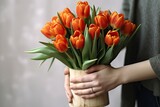 Illustration of a woman holding a bouquet of vivid orange tulips created with Generative AI technology