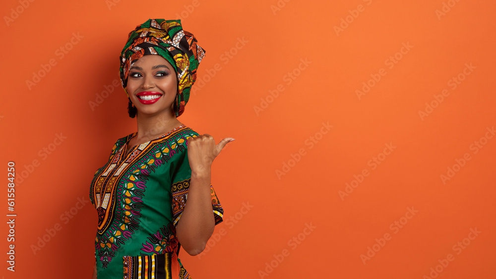 Positive young black woman pointing at copy space, web-banner Positive young black woman pointing at copy space, web-banner