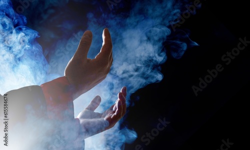 Muslim man hands praying on dark background