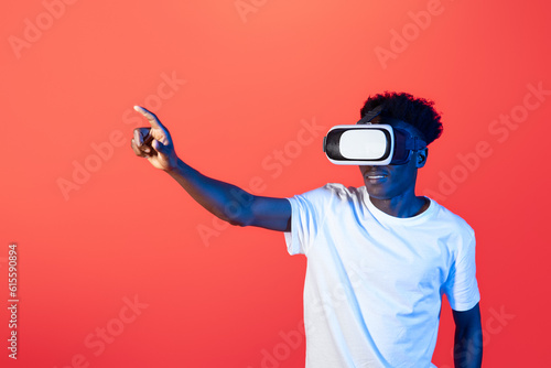 Millennial african american man wearing high tech smart vr goggles