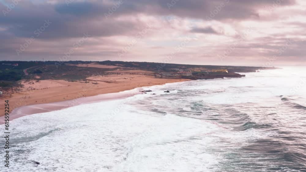 Stormy sunny summer day on Atlantic ocean beach in Portugal Praia da Guincho. Beautiful sea view. Aerial view on sandy beach Stormy sunny summer day on Atlantic ocean beach in Portugal Praia da Guincho. Beautiful sea view. Aerial view on sandy beach