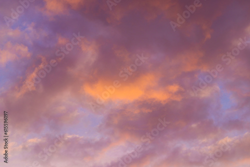 Beautiful sky background. Orange and purple sunset. Texture for you design