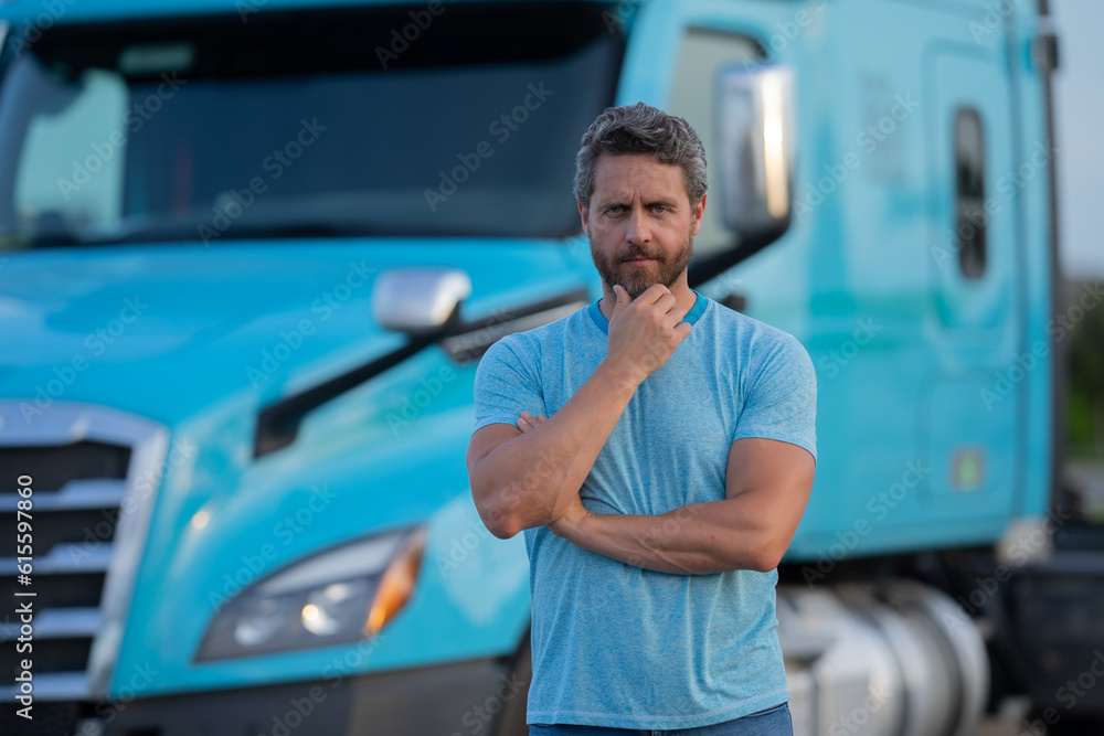 Men driver near lorry truck. Man owner truck driver in t-shirt near truck. Handsome middle aged man trucker trucking owner. Transportation industry vehicles. Handsome man driver front of truck.
