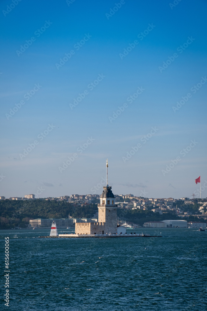After restoration, the Historical Maiden's Tower and Dolmabahce Palace in the background. Kiz Kulesi, Istanbul. Turkey.