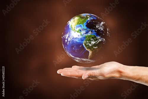 Protecting concept  hand holds a globe