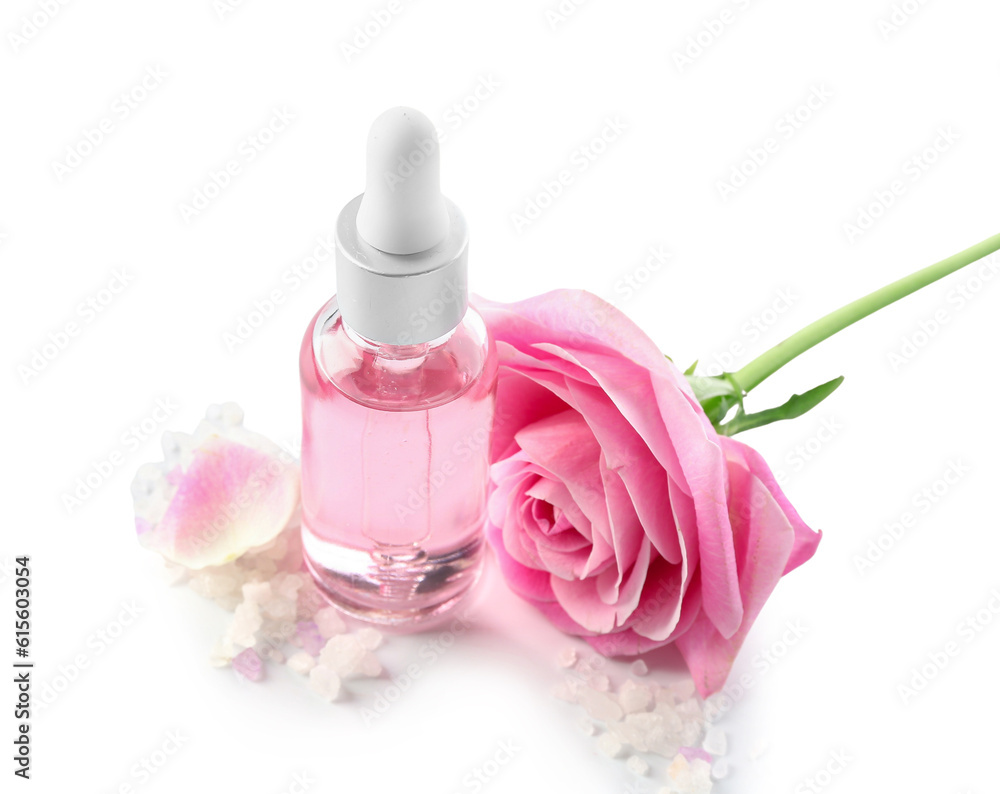 Bottle of cosmetic oil with rose extract and flower on white background Bottle of cosmetic oil with rose extract and flower on white background