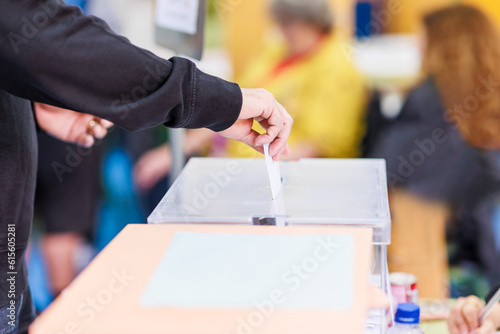 voting candidate campaign in democracy ballot box. Latin mid hand unrecognizable man 