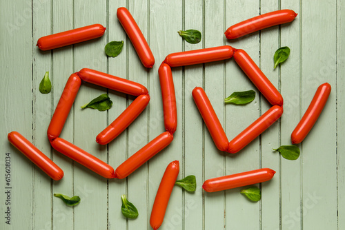 Red hot dogs and fresh gree...