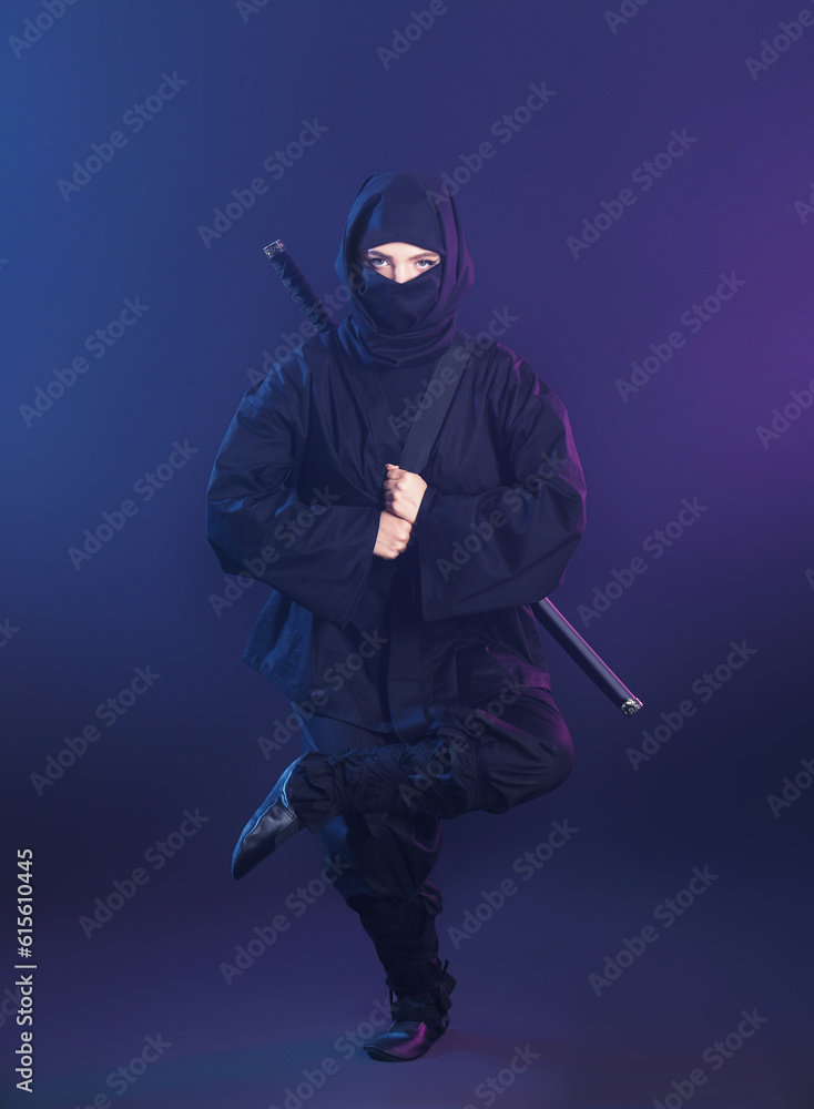 Female ninja on dark background Female ninja on dark background