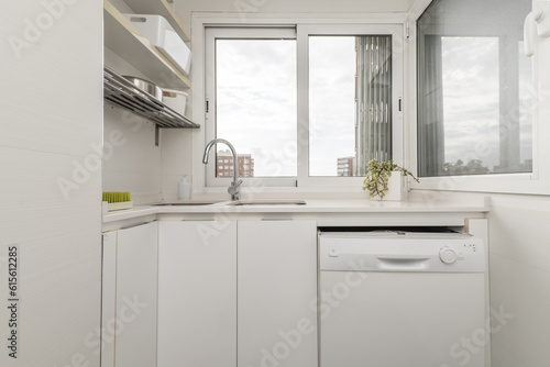 Small kitchen cubicle with dishwasher, double sink
