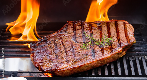 Canvas-taulu delicious meat roasted on a spit with fire under it
