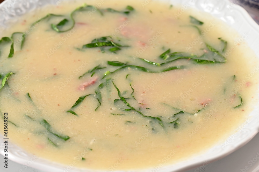 green soup, herbal cream with cassava vegan food natural healthy food with wine in the background. green soup, herbal cream with cassava vegan food natural healthy food with wine in the background.