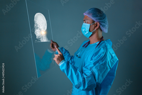 A Doctor, healthcare or futuristic skull scan in brain cancer, injury or fracture analytics in night hospital planning. Medicine, future or hologram xray of skeleton on abstract head for thinking man. photo