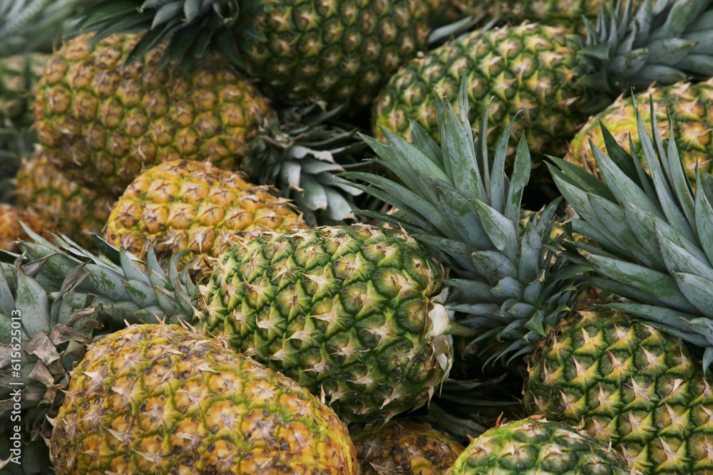 Heap of delicious ripe pineapples as background. Exotic fruit Heap of delicious ripe pineapples as background. Exotic fruit
