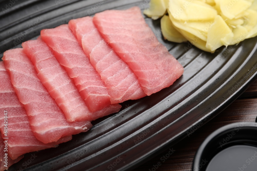 Tasty sashimi (pieces of fresh raw tuna) on plate, closeup Tasty sashimi (pieces of fresh raw tuna) on plate, closeup