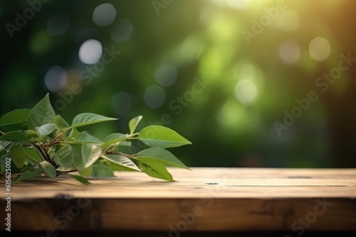 Wooden board empty table with blurred green leaf background