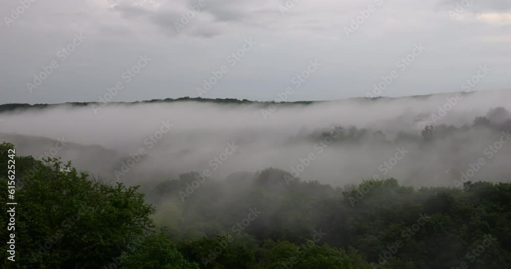 Top view of misty hollow in twilight. Top view of misty hollow in twilight.