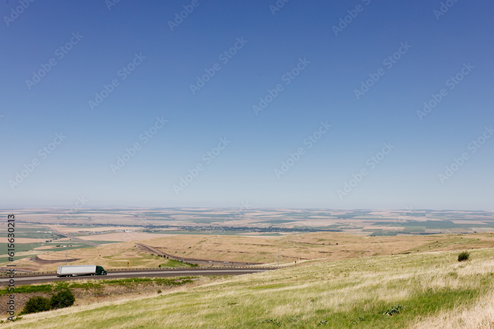Beautiful summer landscape with meadows and a road from a bird's eye view. Nature in Oregon. Panorama