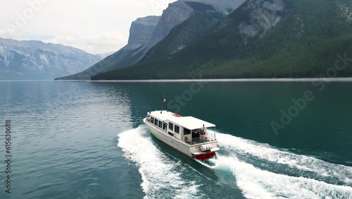 Drone shot, lake Minnewanka ferry, explorer boat ,in the Canadian Rockies,  Banff National park.
