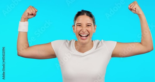 Woman, face and fitness with flex, strong arms or muscle for smile, excited or pride by blue background. Girl bodybuilder, happy and body development with comic laughing for success, exercise or goal