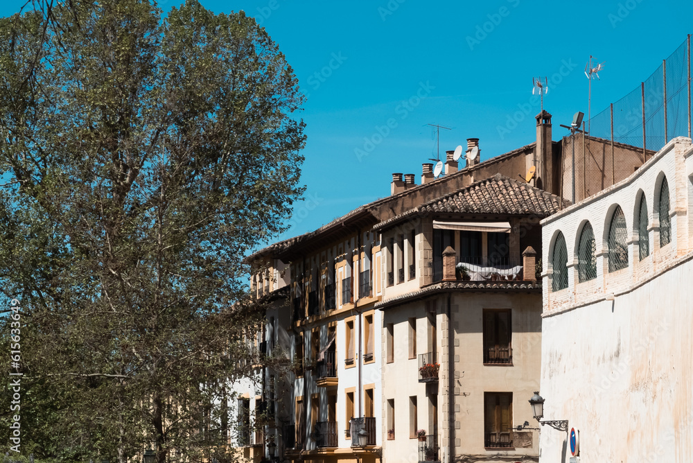 Granada,Spain. April 14, 2022: Architecture of the center of Granada on a summer day and blue sky. Granada,Spain. April 14, 2022: Architecture of the center of Granada on a summer day and blue sky.