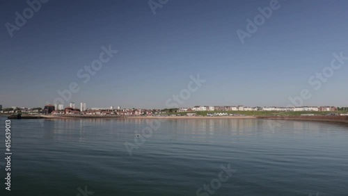 Panoramic shot of Roker Seafront from Roker Pier in Sunderland, UK. Bright Morning. Panning Shot. photo