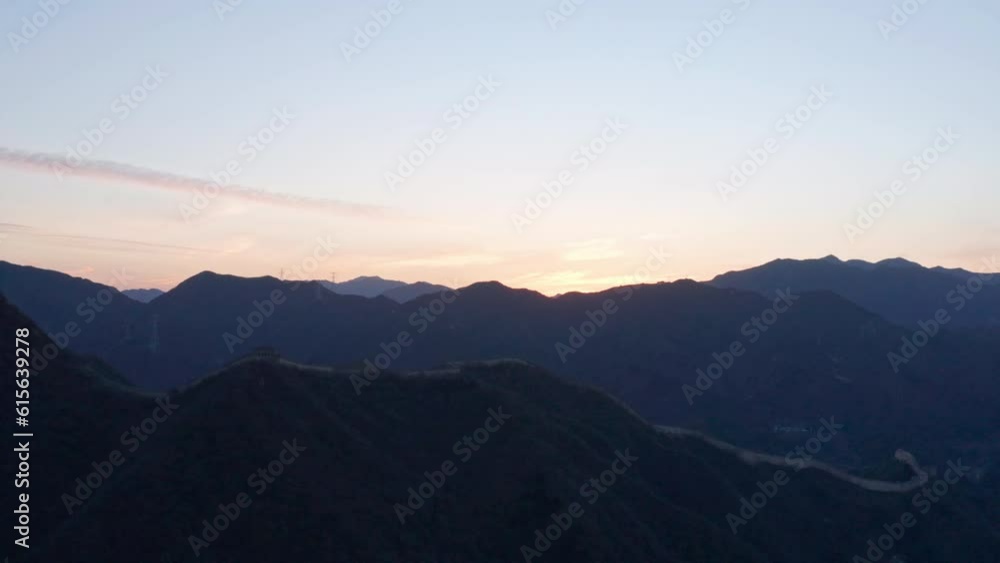 Aerial Shot of The Great Wall of China in Mountains at Sunset. 4K Drone Aerial Shot of The Great Wall of China in Mountains at Sunset. 4K Drone