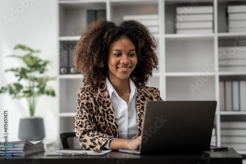 African American Business woman hard working, debtor, deferred debt, Times Interest Earned, Subsidiary Ledger, Special Journal, Shareholders Equity, Scrap value, Price Index, Profitability Ratios photo