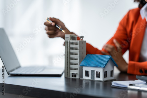 African American realtor working at desk, Housing estate, Vacancy, Prime location, Description of project, Infrastructure, Agency Agreement, Appraisal Price, Electricity Meter and Deposit, Low Rise