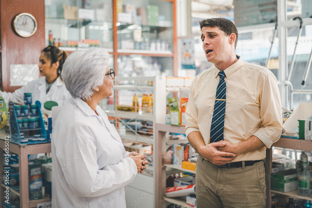pharmacist is asking about a patient's condition in order to prescribe medication according to the patient's symptoms who come for prescription consultation in a modern pharmacy. pharmacist is asking about a patient's condition in order to prescribe medication according to the patient's symptoms who come for prescription consultation in a modern pharmacy.
