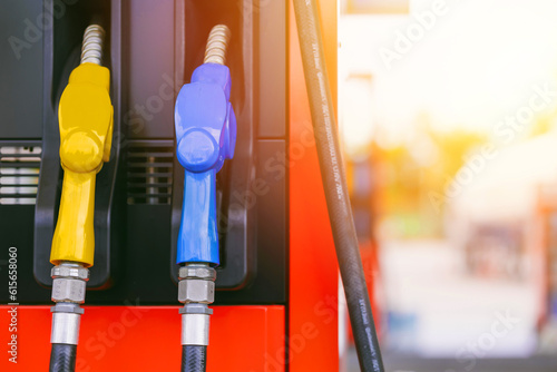 fuel gas station, closeup gasoline fuel nozzle petroleum benzine and diesel or gasohol colors type.