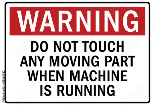 Moving machinery warning sign and labels do not touch any moving part when machine is running