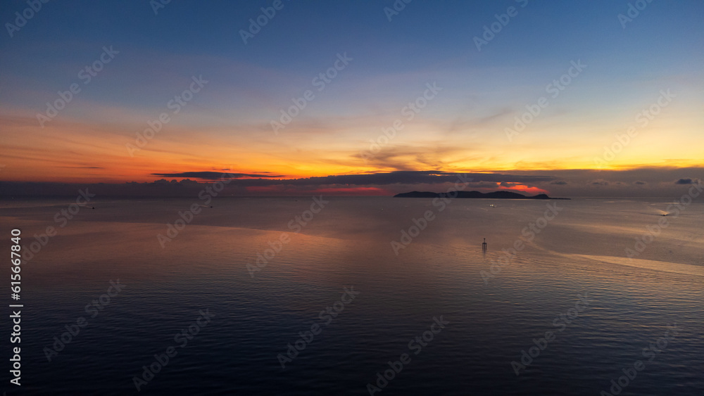 Sunrise sky over horizon in morning with colorful clouds. Orange sunlight.