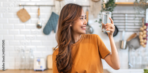 Portrait asian beauty body slim woman drinking water from a bottle while relax and feeling fresh, refresh drink, wellness, diet, healthcare, mineral at home.Healthy liquid lifestyle concept