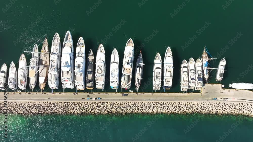 Aerial topdown view over Yachts anchored in the pier of Marina Zeas, Greece Aerial topdown view over Yachts anchored in the pier of Marina Zeas, Greece