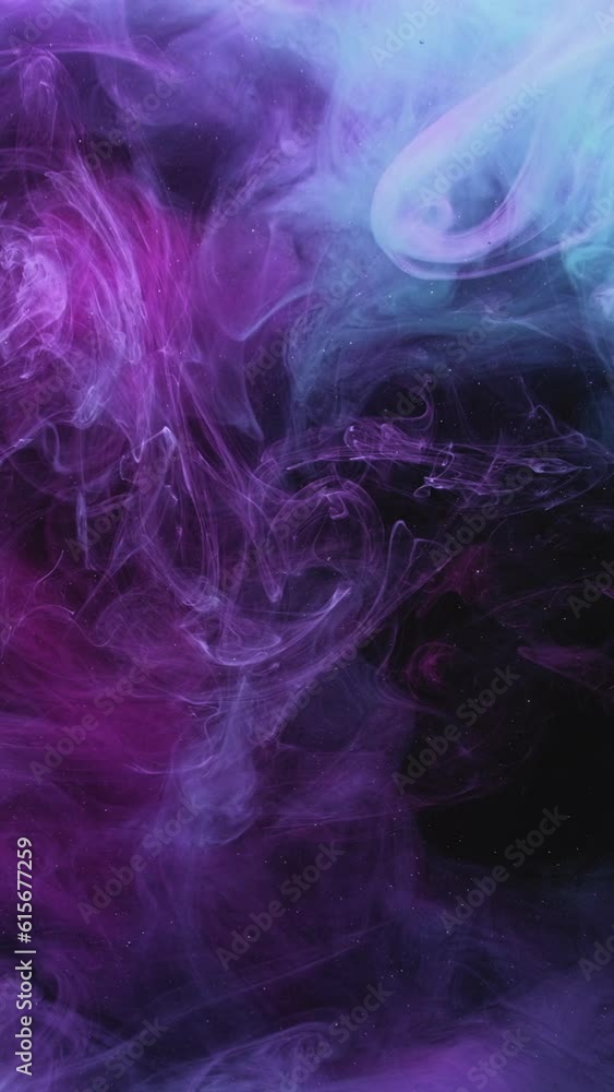 Vertical video. Color smoke cloud. Ink water mix. Fantasy wave. Neon purple blue glitter dust particles fume splash motion on dark black abstract art background. Vertical video. Color smoke cloud. Ink water mix. Fantasy wave. Neon purple blue glitter dust particles fume splash motion on dark black abstract art background.