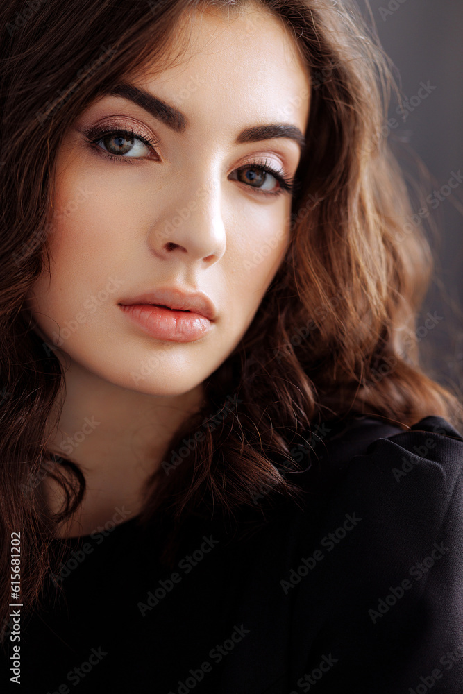 Close-up portrait of young beautiful brunette woman in black. Long hair, clear skin and attractive eyes. Close-up portrait of young beautiful brunette woman in black. Long hair, clear skin and attractive eyes.