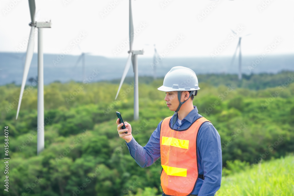 Portrait of engineer asian man working in wind turbine farm. Portrait of engineer asian man working in wind turbine farm.