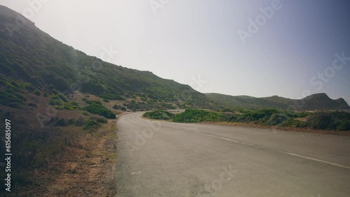 Street following mountain side at cape point national park